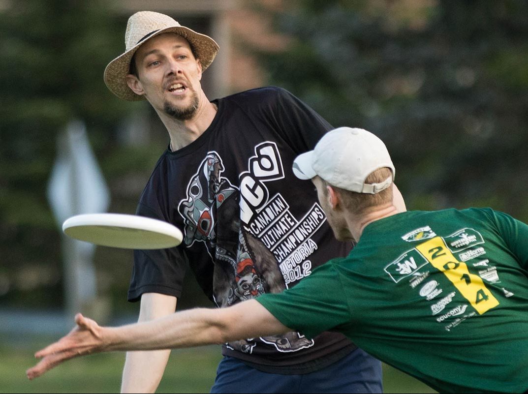 Ultimate players playing hard on a field