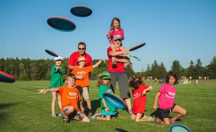 Youth league participants throwing discs